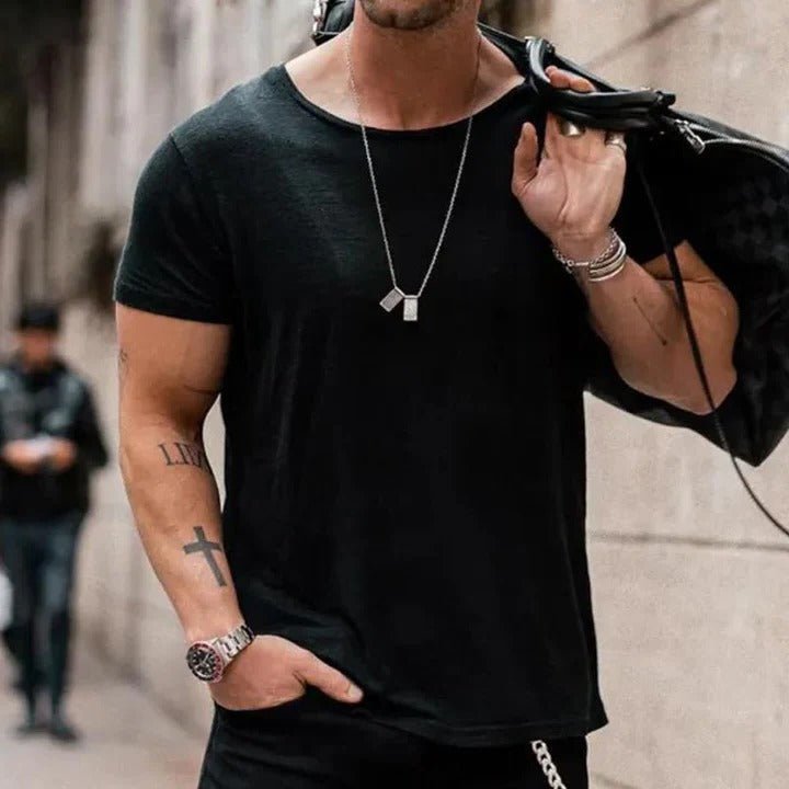 Men’s T-shirt with a round neckline, short sleeves, and relaxed fit, ideal for casual outings, layering, lounging, and everyday wear.