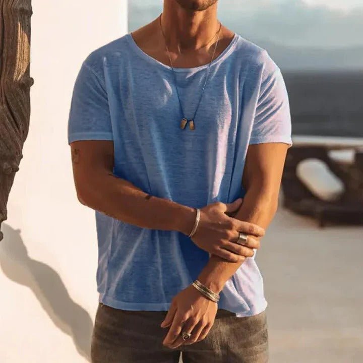 Men’s T-shirt with a round neckline, short sleeves, and relaxed fit, ideal for casual outings, layering, lounging, and everyday wear.