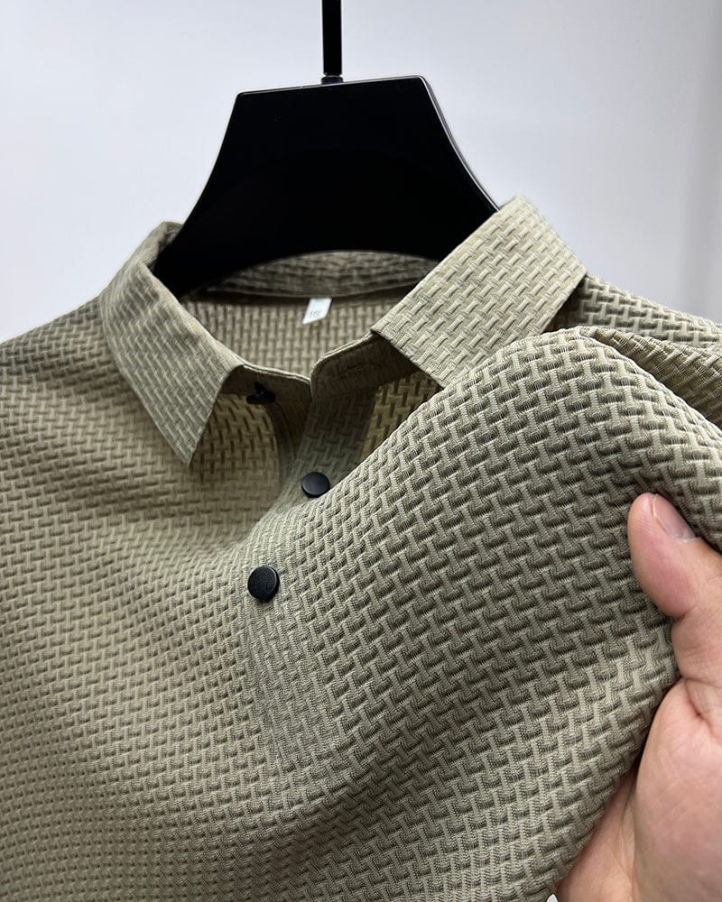 Men’s textured polo shirt with a button placket, short sleeves, and tailored fit, ideal for summer days, casual outings, and smart-casual wear.