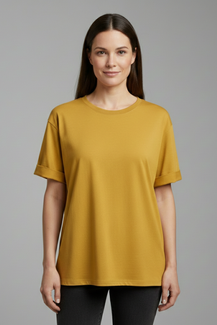 Women’s oversized T-shirt with round neckline, rolled short sleeves, loose fit, and hip-length hem, suitable for casual wear and relaxed outfits.