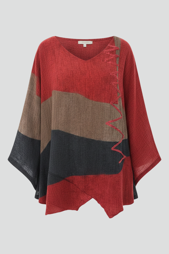 Women’s printed V-neck top with loose fit, wide short sleeves, and asymmetrical hem with side slits, suitable for summer and casual outfits.