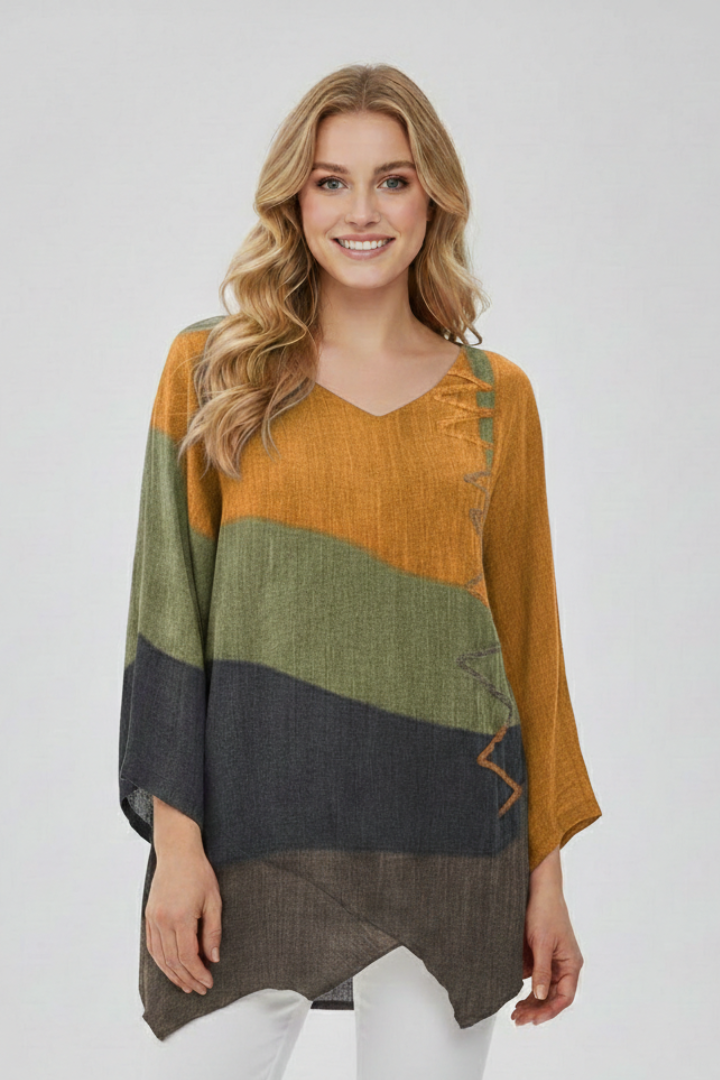 Women’s printed V-neck top with loose fit, wide short sleeves, and asymmetrical hem with side slits, suitable for summer and casual outfits.