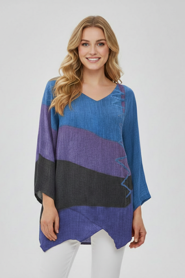 Women’s printed V-neck top with loose fit, wide short sleeves, and asymmetrical hem with side slits, suitable for summer and casual outfits.