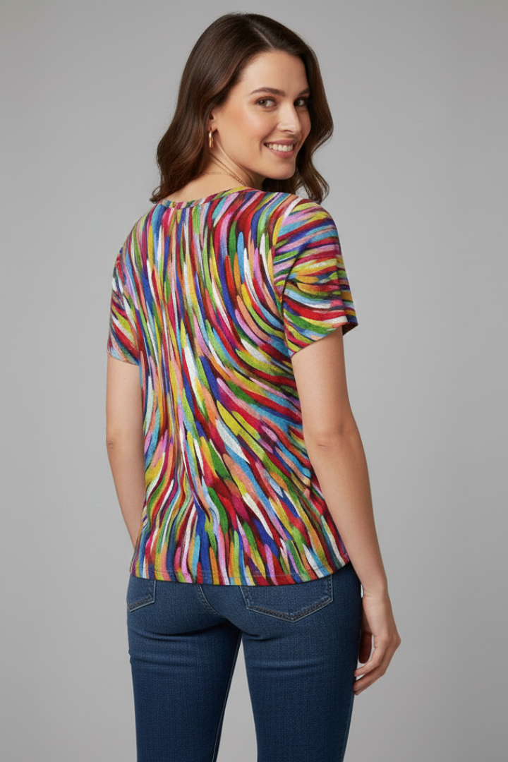 Women’s printed V-neck T-shirt with short sleeves, loose fit, curved hem, and all-over pattern, suitable for casual wear and summer outfits.