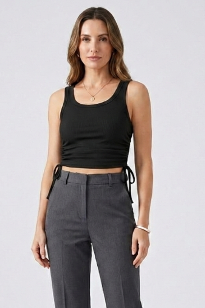 Women’s crop top with side ruching, round neckline, and ribbed texture, designed for casual wear and summer outfits