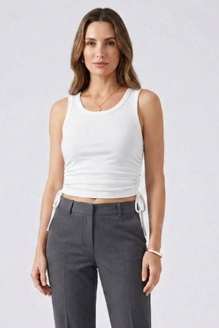 Women’s crop top with side ruching, round neckline, and ribbed texture, designed for casual wear and summer outfits