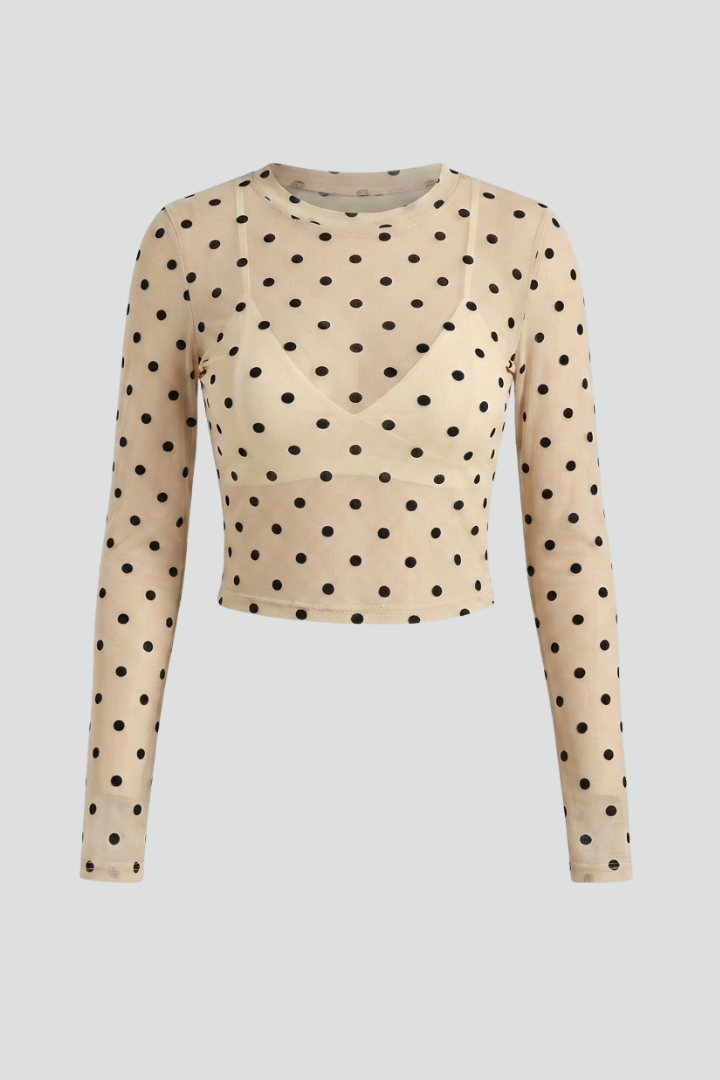 Women’s sheer blouse with round neckline and polka dot textured pattern, designed for casual styling and evening wear
