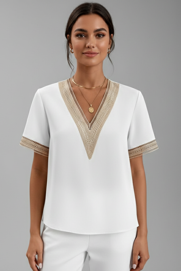 Women’s V-neck blouse with decorative trim, short sleeves, and straight fit, suitable for everyday wear and office outfits.