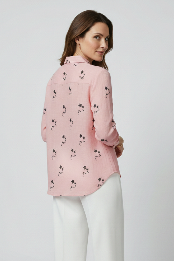 Women’s blouse with button front and floral print, featuring long sleeves and a round neckline for everyday and work styling.