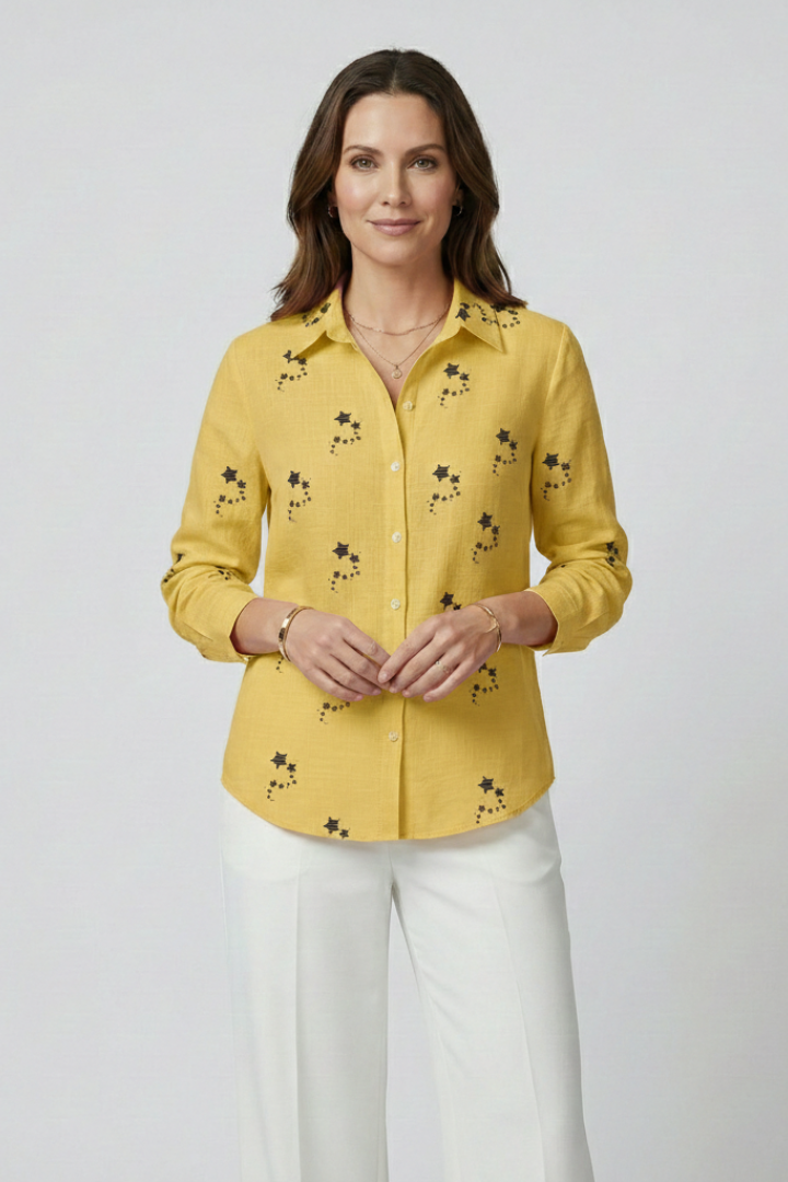 Women’s blouse with button front and floral print, featuring long sleeves and a round neckline for everyday and work styling.