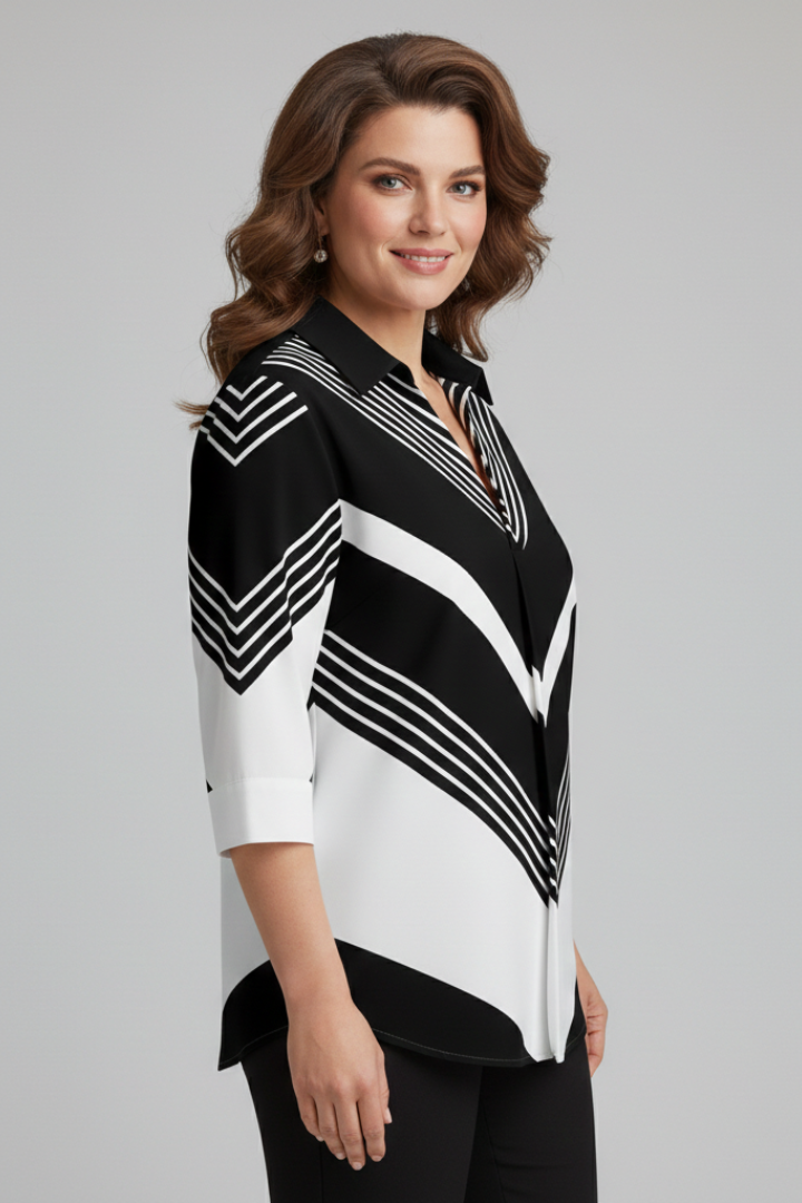 Women’s blouse with chevron stripe print and button front detail, featuring three-quarter sleeves and an asymmetrical hem for everyday styling.