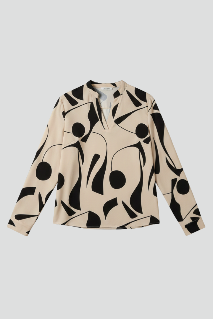 Women’s collared blouse with button front and abstract print, featuring long sleeves and a curved hem for everyday and work styling.