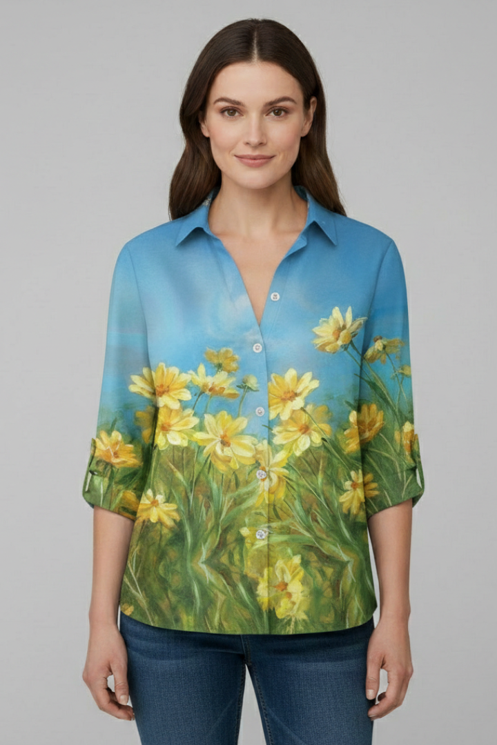 Women’s blouse with collared neckline and floral print, featuring long sleeves and button closure for everyday and work styling.