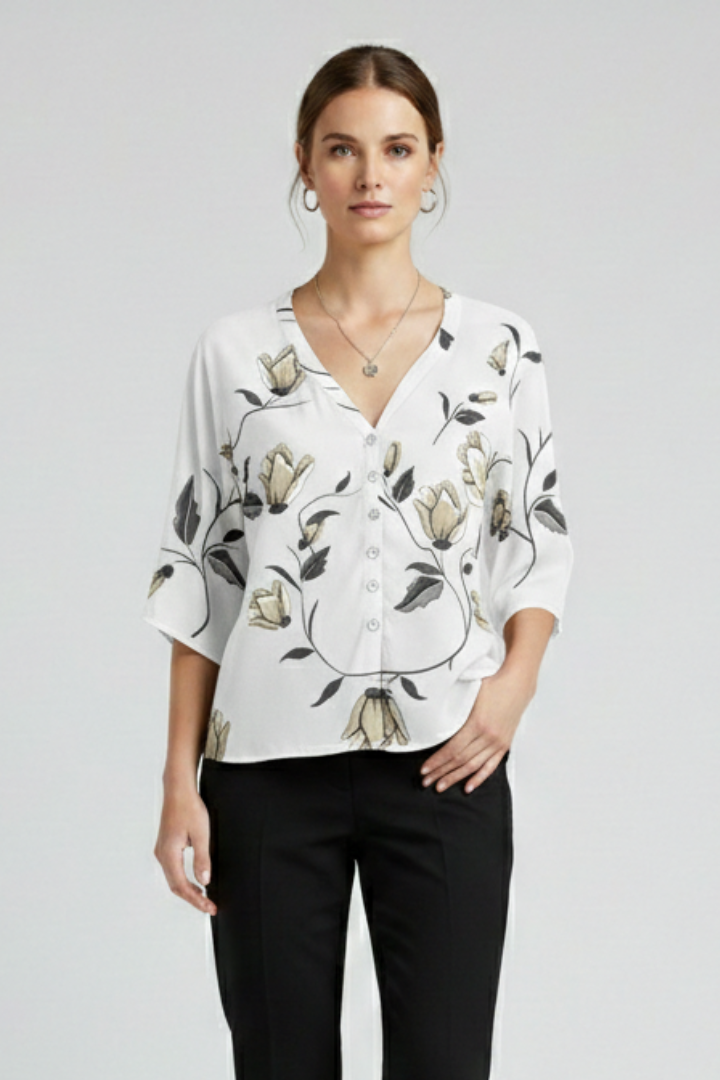 Women’s blouse with V-neckline and front button detailing, featuring short sleeves and floral print for everyday and casual styling.