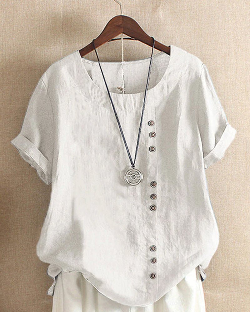 Women’s blouse with decorative button details, short sleeves, and a relaxed fit, ideal for casual summer outfits, travel, and everyday wear.