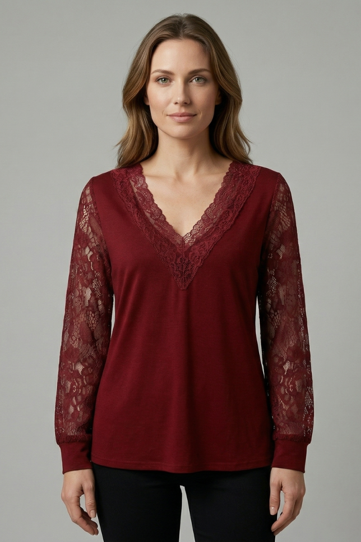 Women’s blouse with textured lace sleeves, structured V-neckline, straight hem, and smooth woven surface for elegant everyday styling.