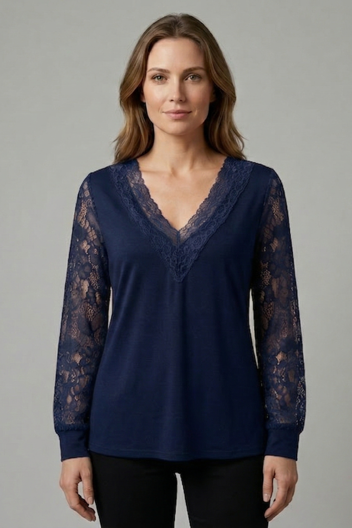 Women’s blouse with textured lace sleeves, structured V-neckline, straight hem, and smooth woven surface for elegant everyday styling.