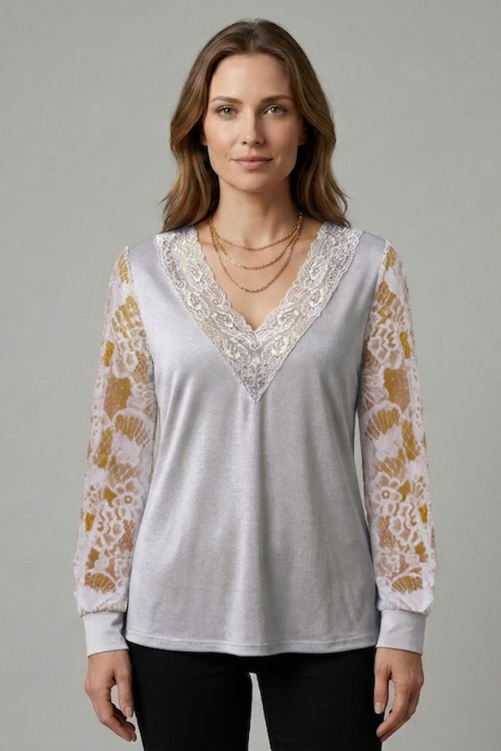 Women’s blouse with textured lace sleeves, structured V-neckline, straight hem, and smooth woven surface for elegant everyday styling.
