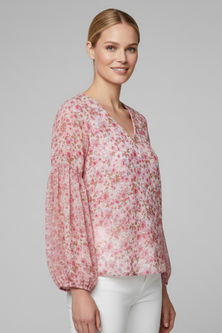 Women’s long sleeve blouse with V-neckline, elasticated cuffs, and all-over floral print, suitable for casual wear and everyday styling.