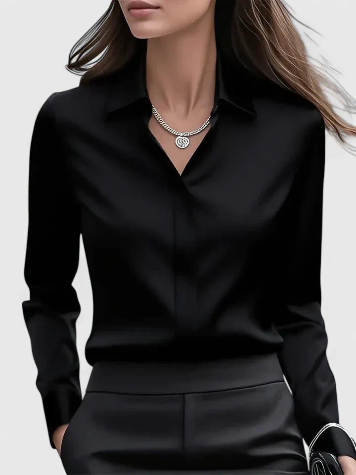 Women’s button front top with a collared neckline, curved hem, and relaxed fit, ideal for office wear and smart-casual outfits.