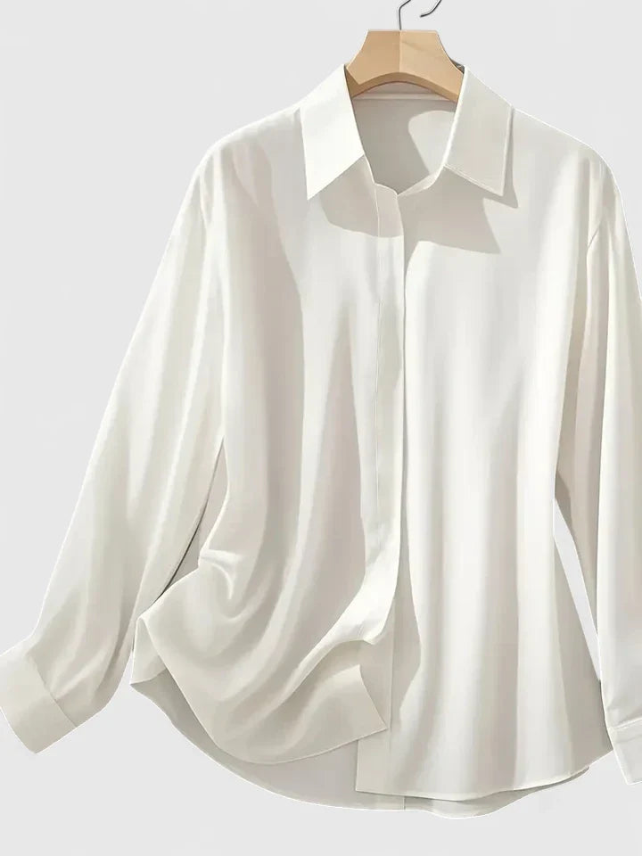 Women’s button front top with a collared neckline, curved hem, and relaxed fit, ideal for office wear and smart-casual outfits.