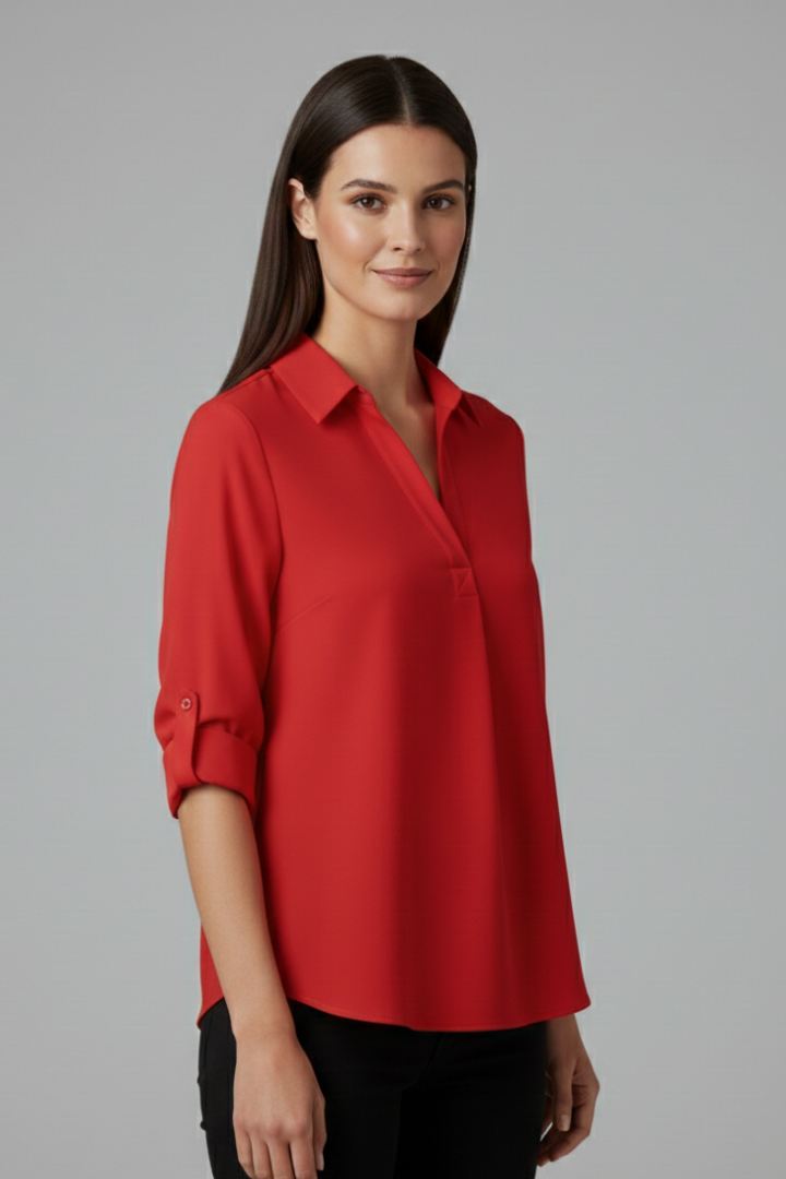 Women’s button-up blouse with collared neckline, long sleeves, and chest pocket, suitable for office wear and everyday styling.