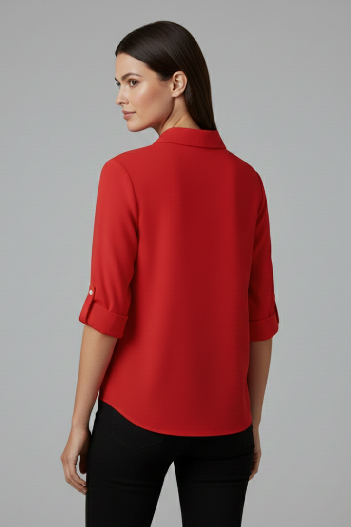 Women’s button-up blouse with collared neckline, long sleeves, and chest pocket, suitable for office wear and everyday styling.