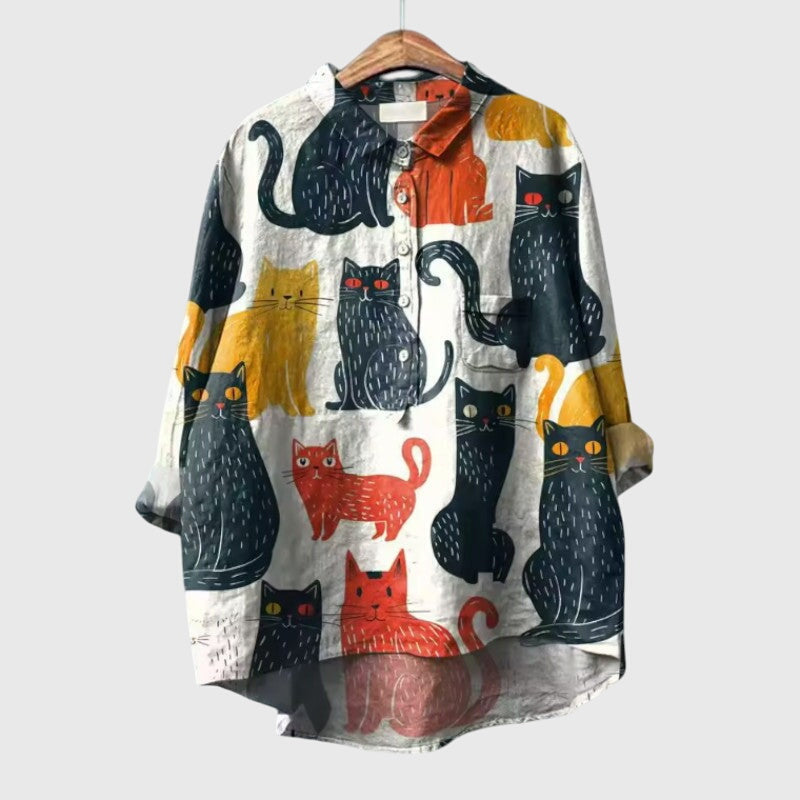 Women’s cat print blouse with a relaxed fit and playful design, perfect for casual wear, daily outfits, and comfortable styling.