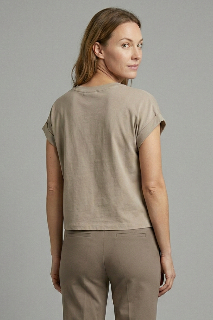 Women’s crop top with cap sleeves and round neckline, ideal for casual summer outfits and everyday fashion styling.