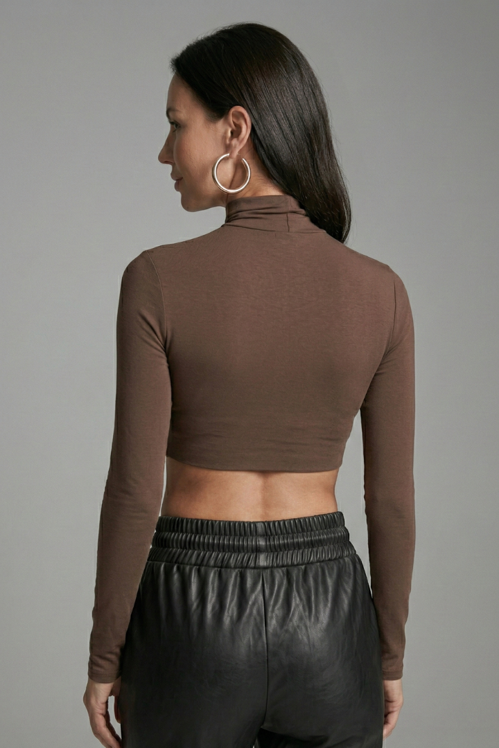 Women’s crop top with high neckline and long sleeves, ideal for casual everyday outfits and seasonal fashion styling.