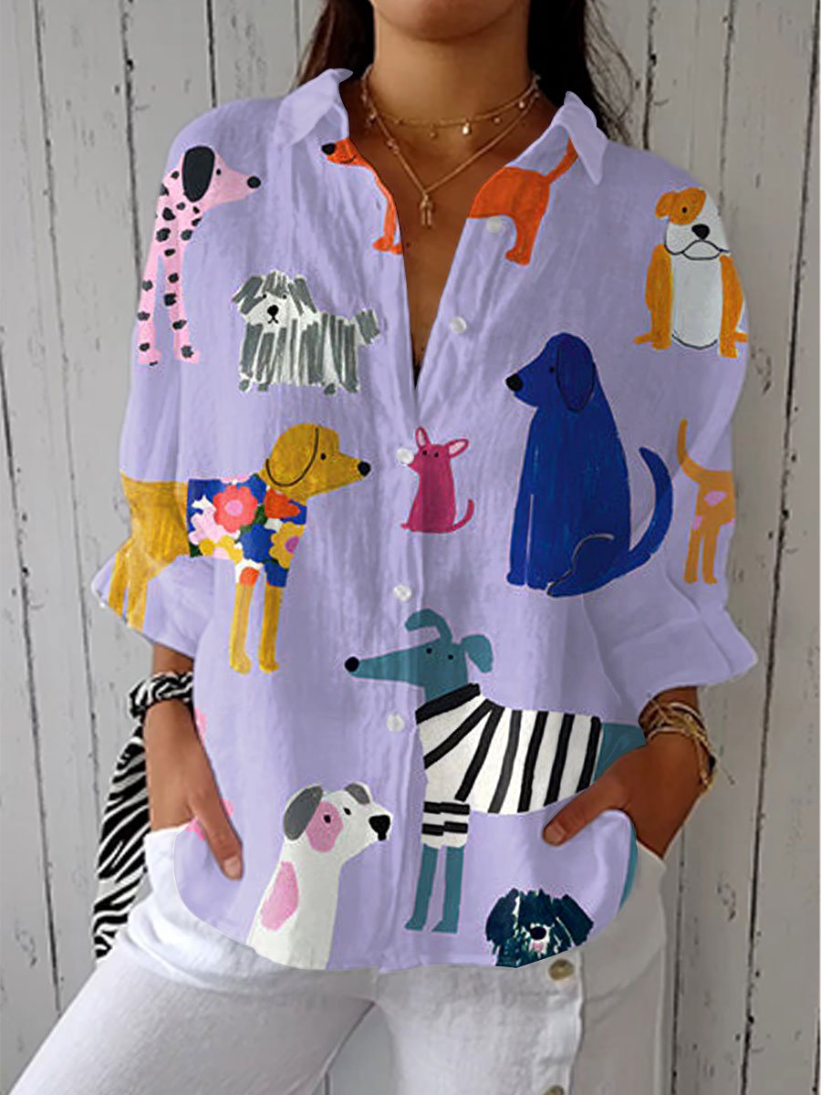 Women’s dog print blouse with button-front closure, V-neckline, long sleeves, and relaxed fit, suitable for casual outings and everyday styling.