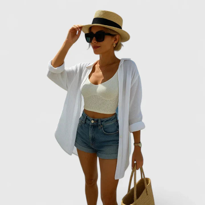 Women’s elegant blouse with embroidered back detailing and a relaxed fit, suitable for summer outfits, casual wear, and vacation styling.