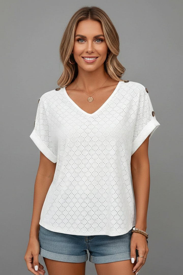 Women’s eyelet T-shirt with V-neckline, button detail, and rolled sleeves, suitable for everyday wear and casual outfits.