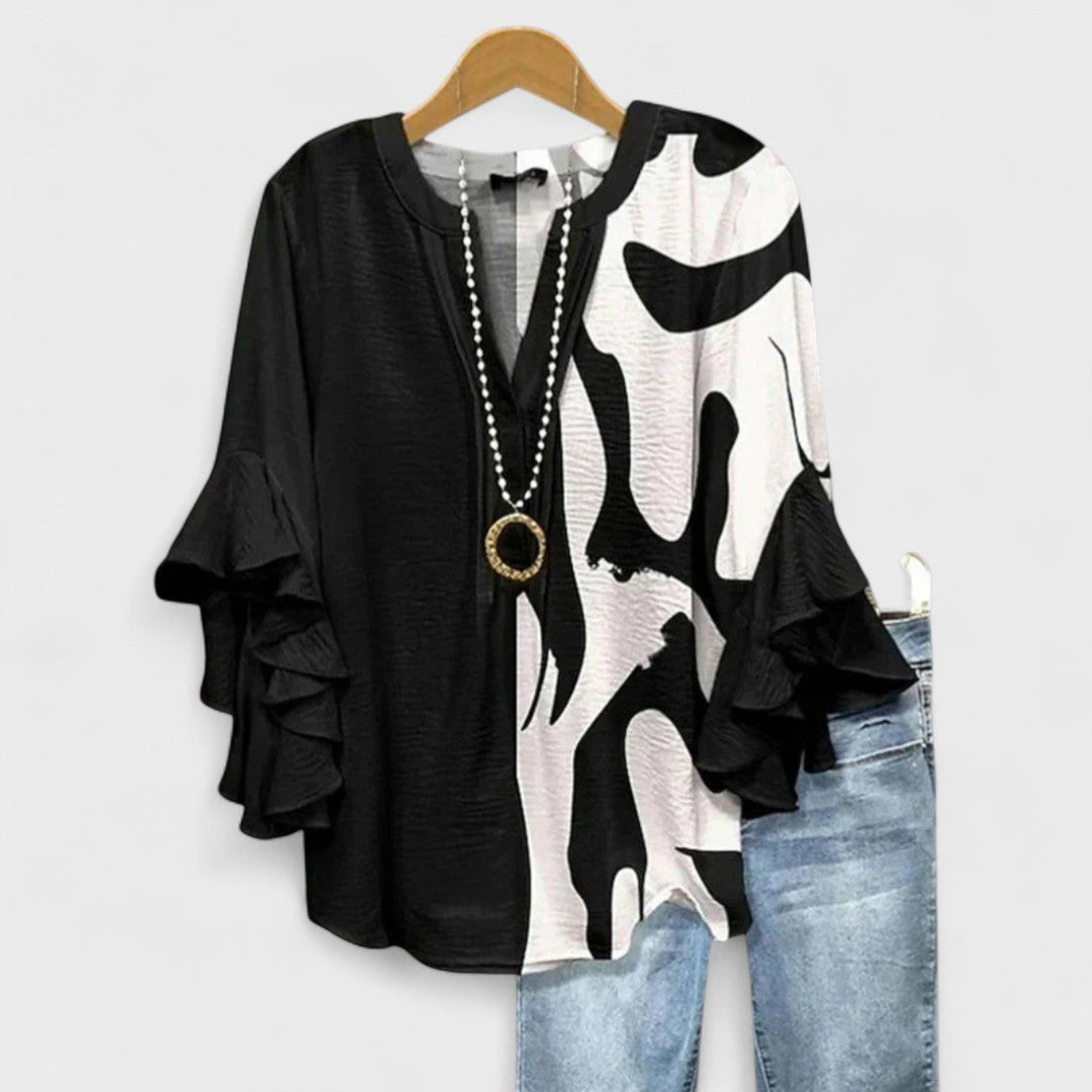 Women’s floral blouse with ruffle sleeves, V-neckline, and relaxed fit, suitable for office wear, casual outings, and everyday styling.