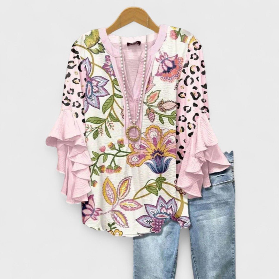 Women’s floral blouse with ruffle sleeves, V-neckline, and relaxed fit, suitable for office wear, casual outings, and everyday styling.