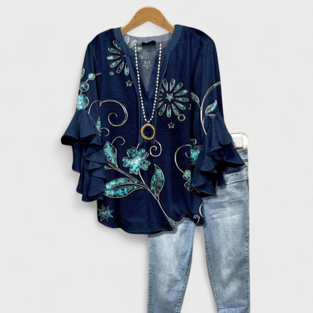 Women’s floral blouse with ruffle sleeves, V-neckline, and relaxed fit, suitable for office wear, casual outings, and everyday styling.
