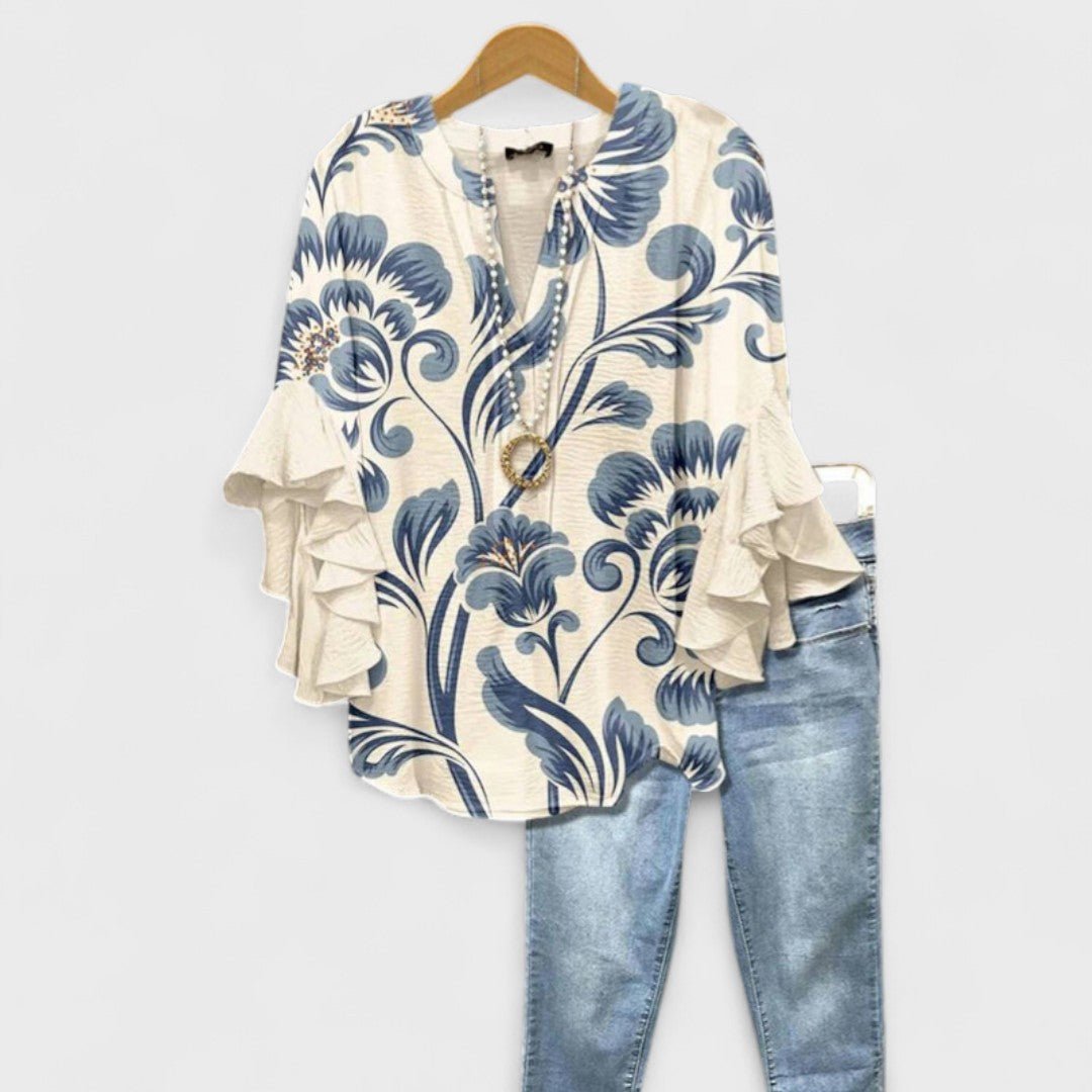 Women’s floral blouse with ruffle sleeves, V-neckline, and relaxed fit, suitable for office wear, casual outings, and everyday styling.