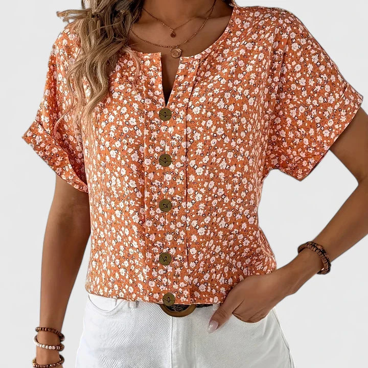 Women’s floral blouse with button-up front and relaxed fit, ideal for office wear, vacations, and casual everyday styling.