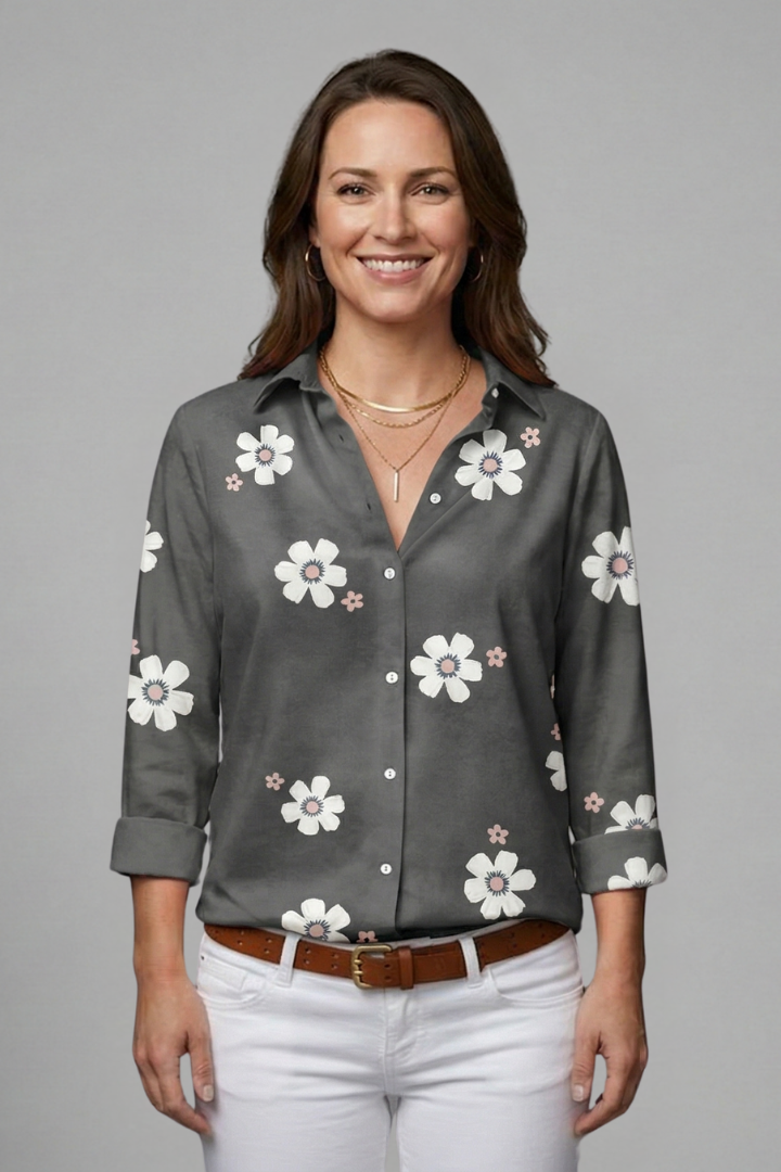 Women’s floral blouse with collar neckline, button front, and roll-up sleeves, ideal for office outfits and casual everyday styling.