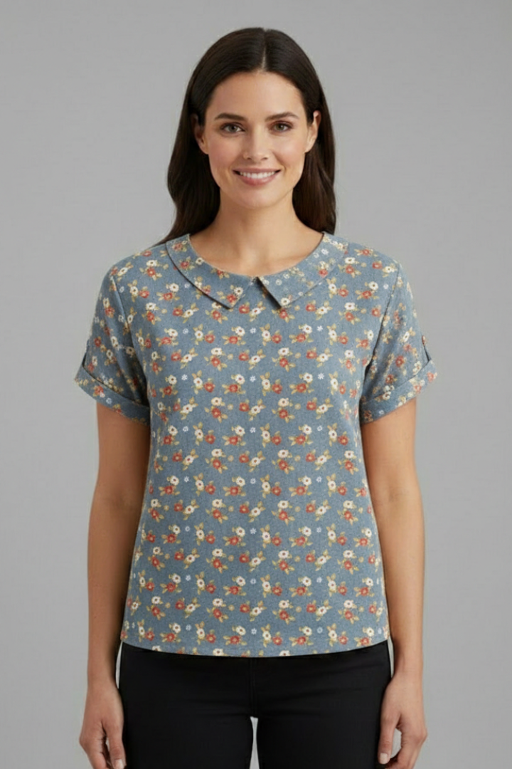 Women’s short sleeve blouse with collared neckline and floral print, featuring a relaxed fit and textured surface for everyday and office wear.
