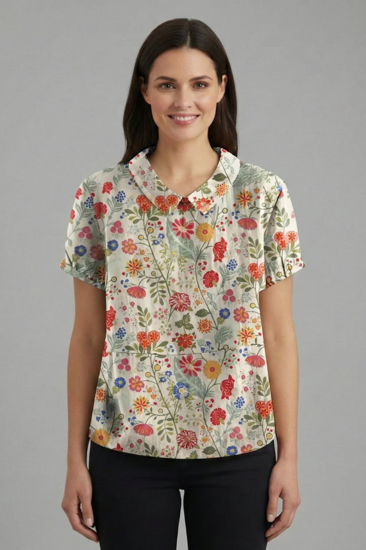 Women’s short sleeve blouse with collared neckline and floral print, featuring a relaxed fit and textured surface for everyday and office wear.