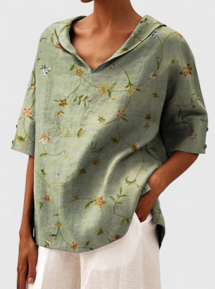 Women’s floral top with a V-neckline and relaxed fit, ideal for spring and summer outings, casual wear, and smart-casual styling.