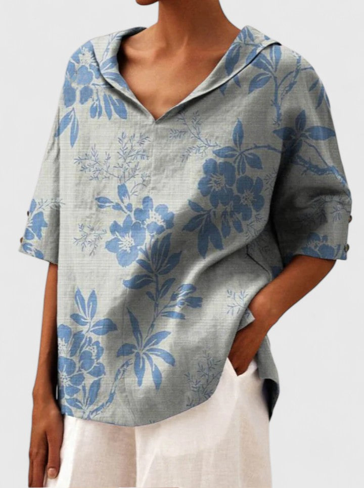 Women’s floral top with a V-neckline and relaxed fit, ideal for spring and summer outings, casual wear, and smart-casual styling.