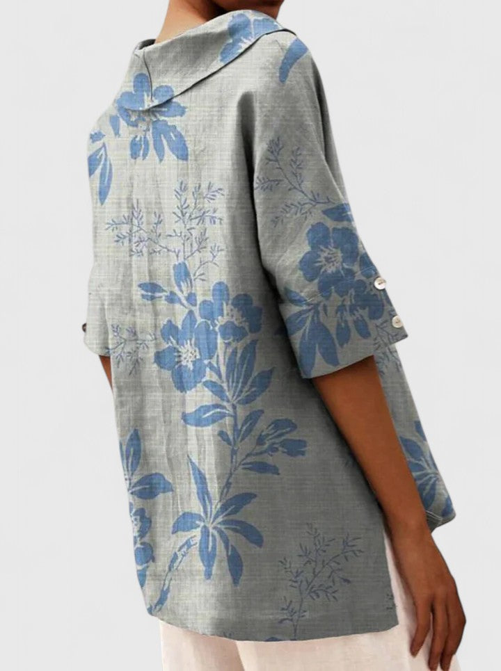 Women’s floral top with a V-neckline and relaxed fit, ideal for spring and summer outings, casual wear, and smart-casual styling.