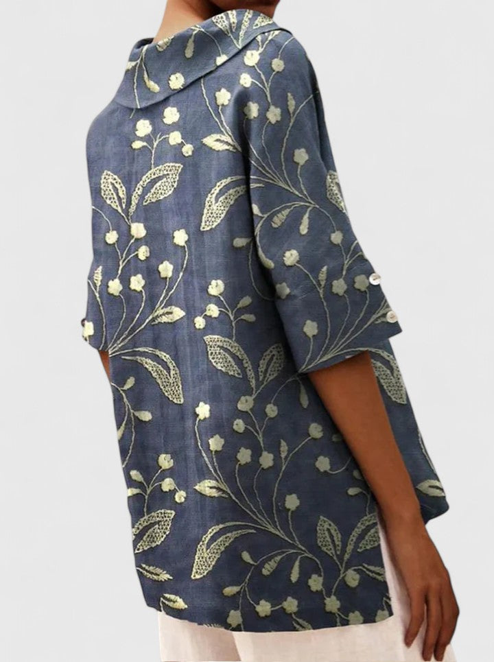Women’s floral top with a V-neckline and relaxed fit, ideal for spring and summer outings, casual wear, and smart-casual styling.