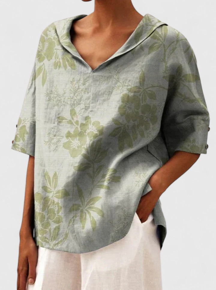 Women’s floral top with a V-neckline and relaxed fit, ideal for spring and summer outings, casual wear, and smart-casual styling.