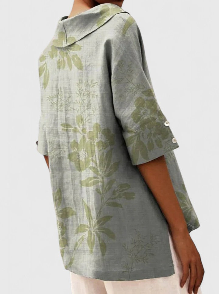Women’s floral top with a V-neckline and relaxed fit, ideal for spring and summer outings, casual wear, and smart-casual styling.