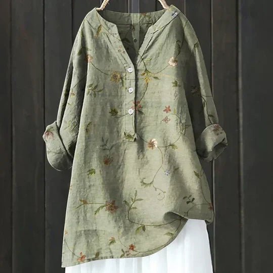 Women’s floral tunic top with button-up front, long sleeves, and relaxed fit, suitable for casual outings, travel, and everyday wear.