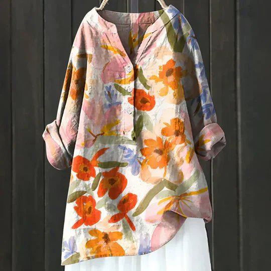 Women’s floral tunic top with button-up front, long sleeves, and relaxed fit, suitable for casual outings, travel, and everyday wear.