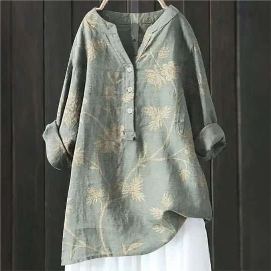 Women’s floral tunic top with button-up front, long sleeves, and relaxed fit, suitable for casual outings, travel, and everyday wear.